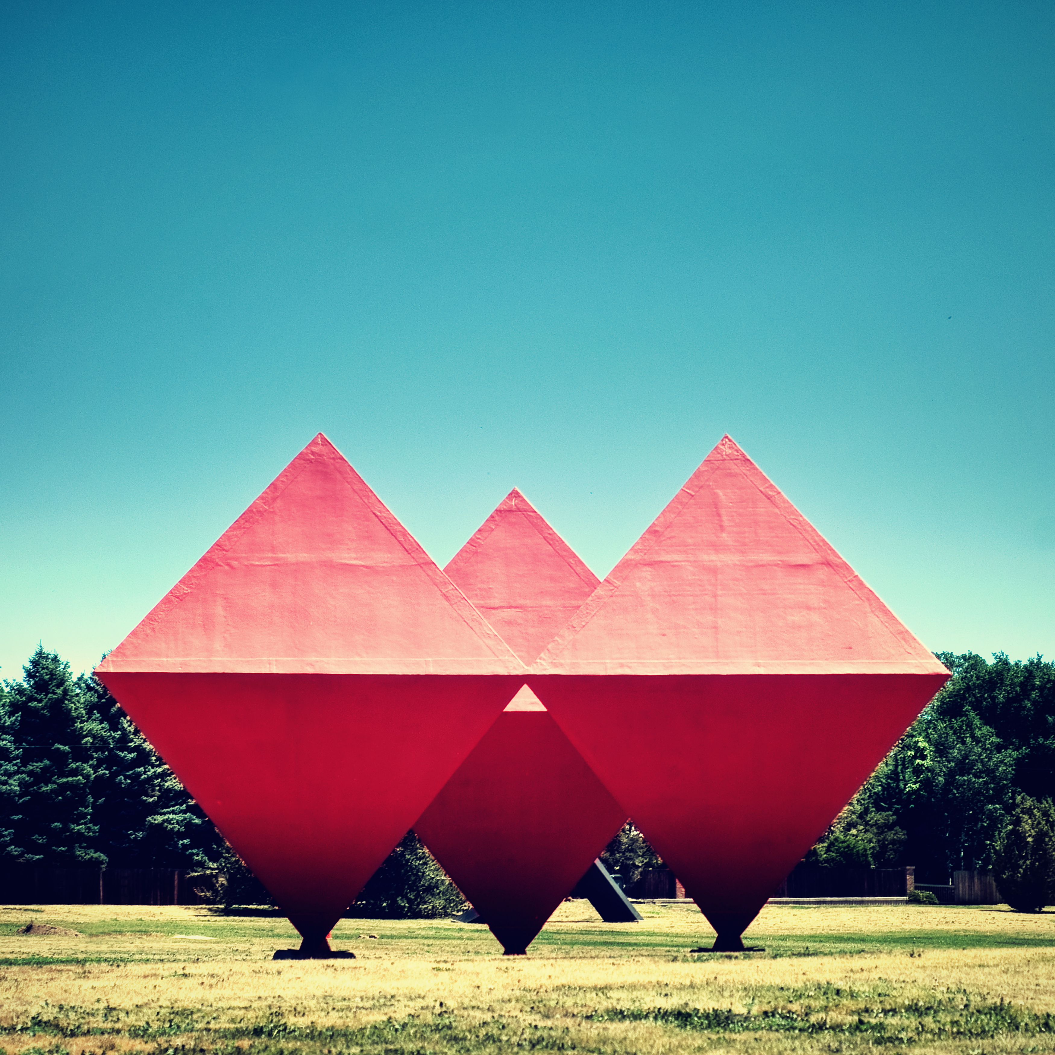 Pink Statues Triangle Cubes